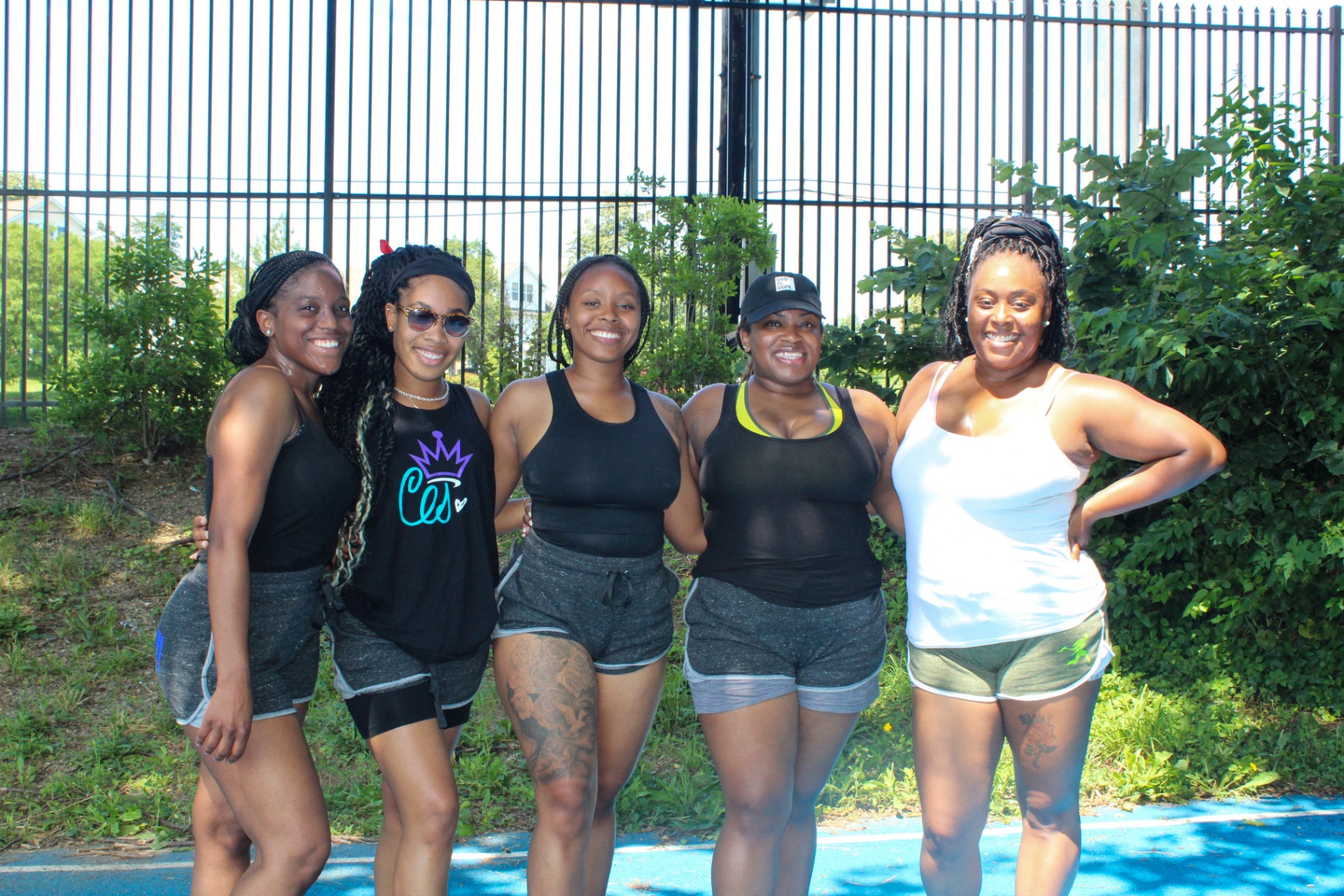 Five women together after an outdoor wellness session